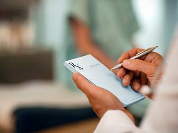 doctor writing prescription